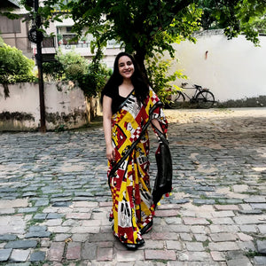 Founder wearing Who Let The Dogs Dress Up yellow red patchwork dog print saree with illustrated dog panels and black zari pallu, Zoomies Collection TTW