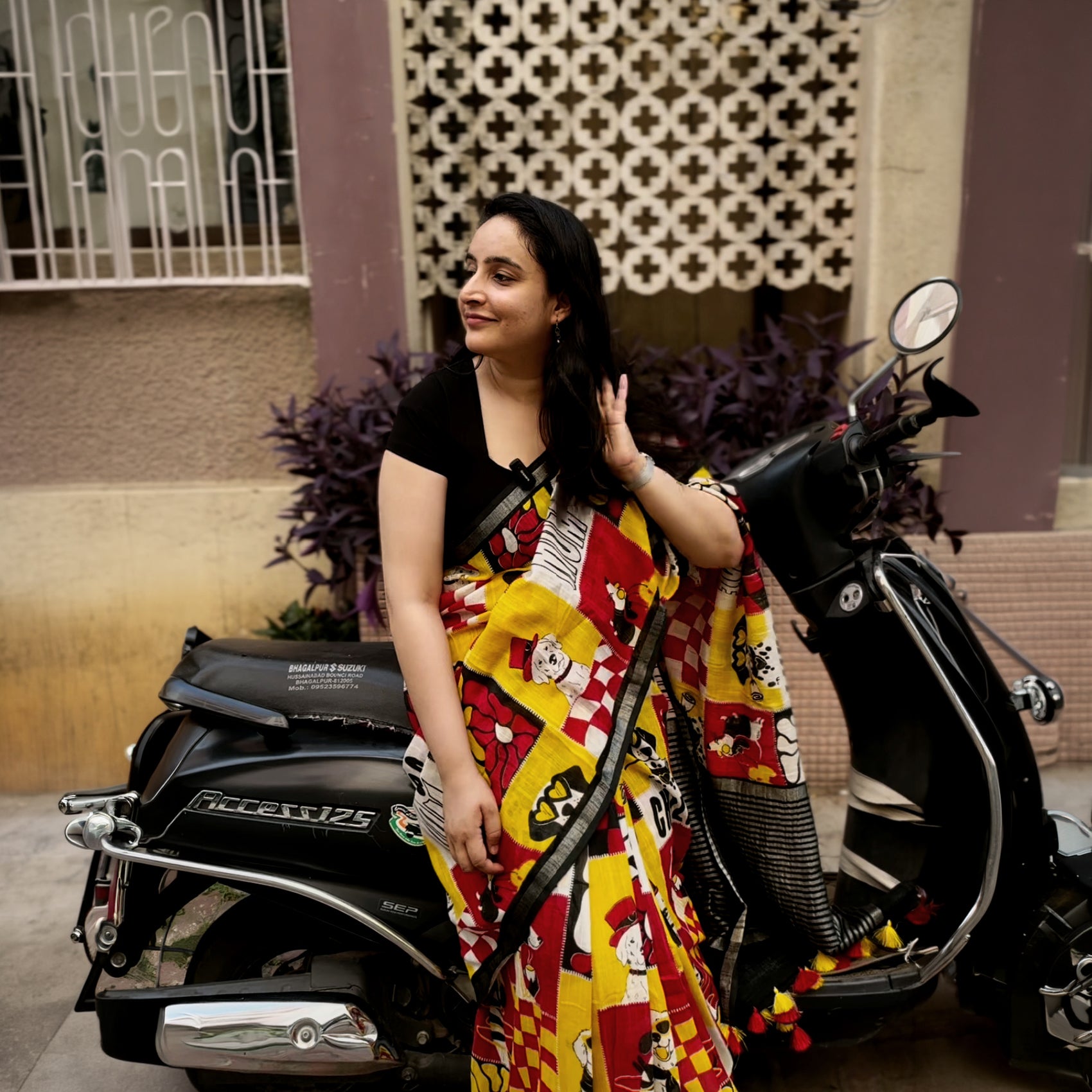 Founder wearing Who Let The Dogs Dress Up yellow red patchwork dog print saree with illustrated dog panels and black zari pallu, Zoomies Collection TTW