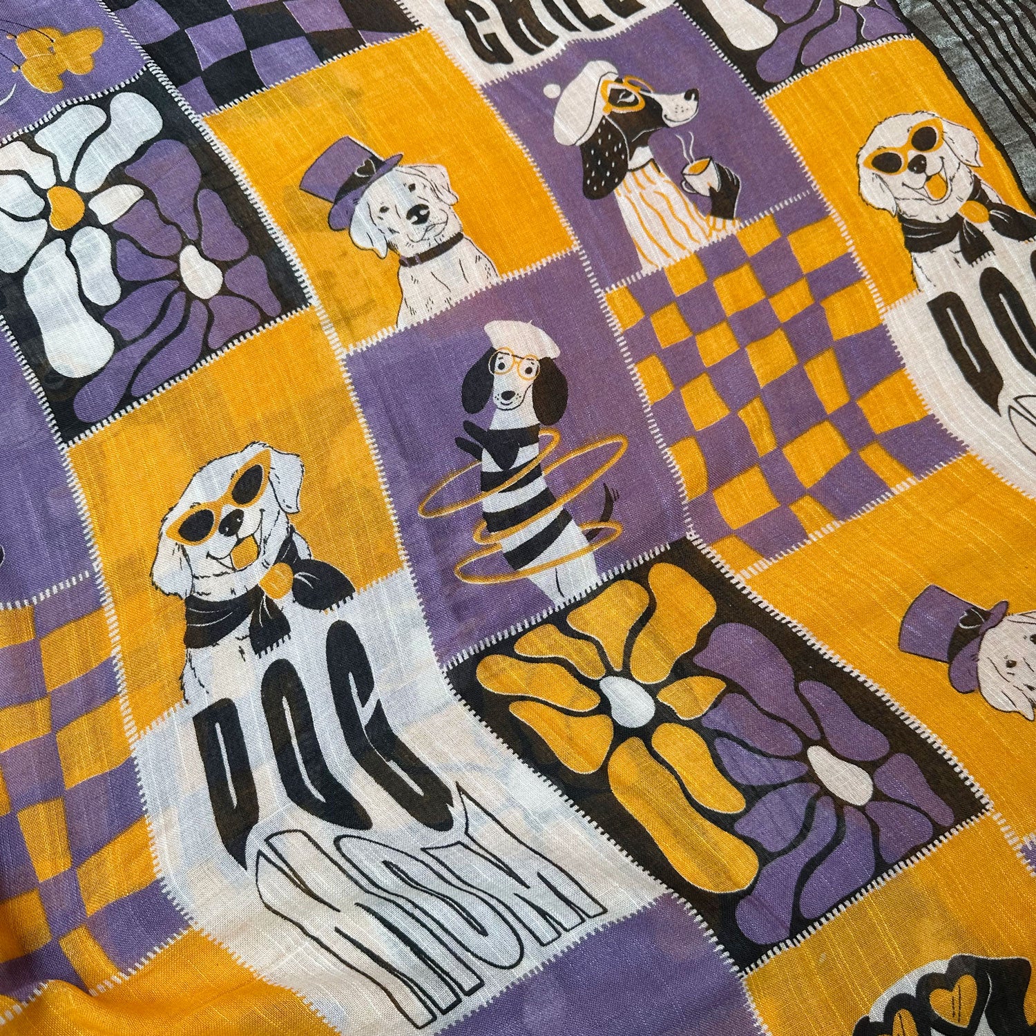 Woof There It Is purple mustard patchwork dog print cotton saree closeup with Dog Mom typography and black zari pallu, Zoomies Collection Thread Weavers