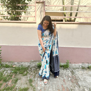Founder wearing Woof & Wonder ivory cotton saree with blue illustrated dog and WOOF typography print and navy zari pallu paired with Navy Blue Blouse, Zoomies Collection TTW