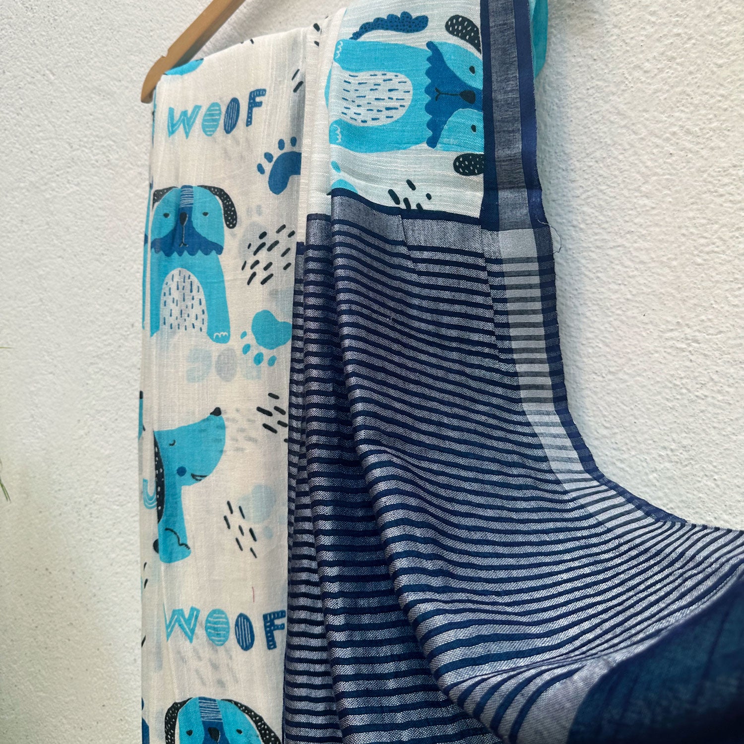Woof & Wonder ivory cotton saree with blue illustrated dog and WOOF typography print and navy zari pallu, Zoomies Collection TTW