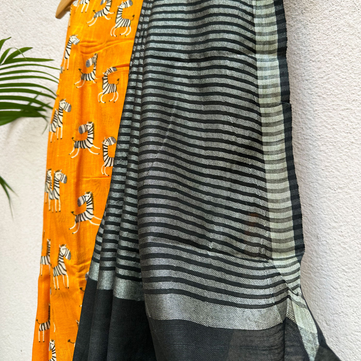 Zebra Cadabra orange printed cotton saree pallu with zebra motifs and grey border, by The Thread Weavers